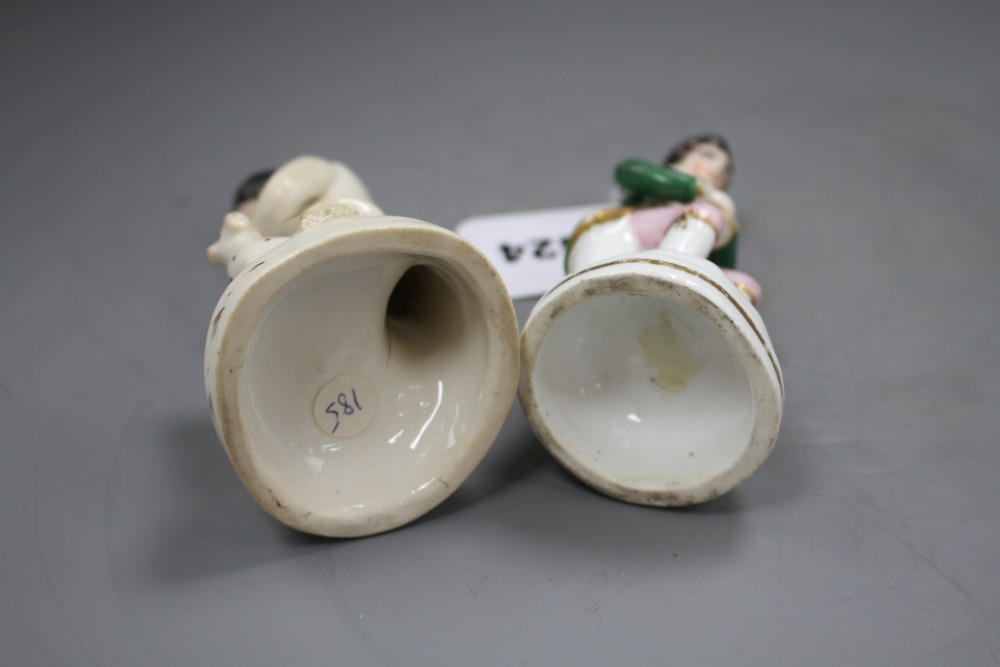 Two Staffordshire porcelain figures of musicians seated by a dog, c.1840-50, H. 11.5 - 12cm